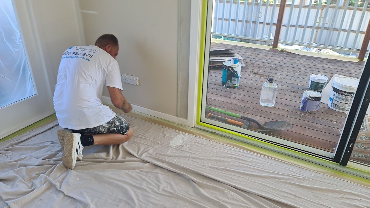 Installing drop cloth for interior painting