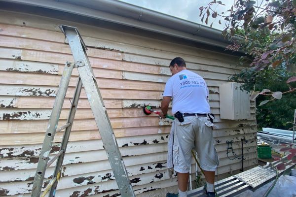 Exterior house painting wall sanding