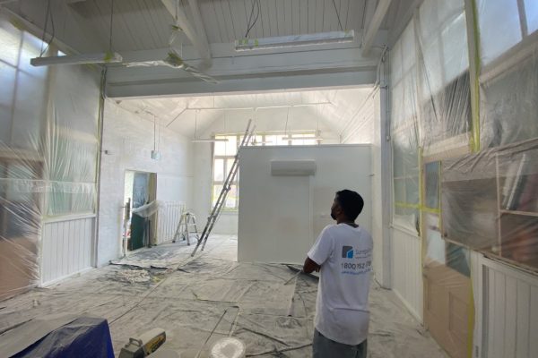 Prepping for interior painting in a school