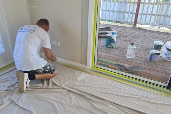 Installing drop cloth for interior painting